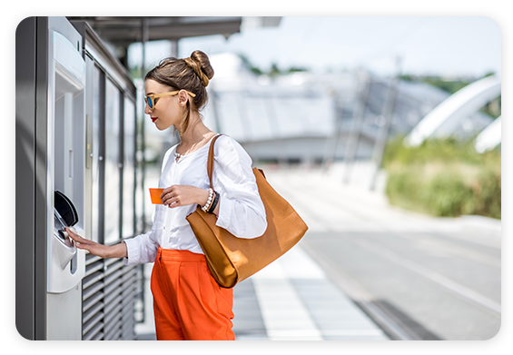 Caucasian woman banking at an ATM