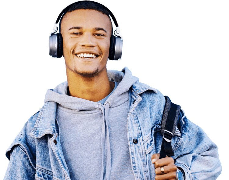 man with headphones and a jean jacket wearing a backpack